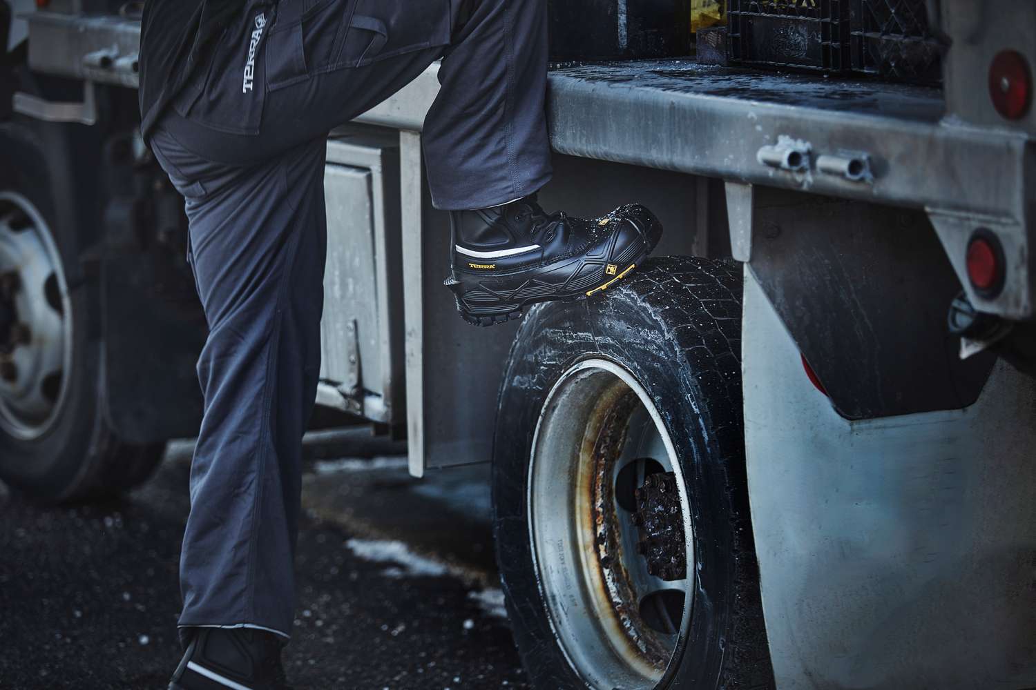 Climbing onto a work truck in Terra Crossbow 777 winter boots