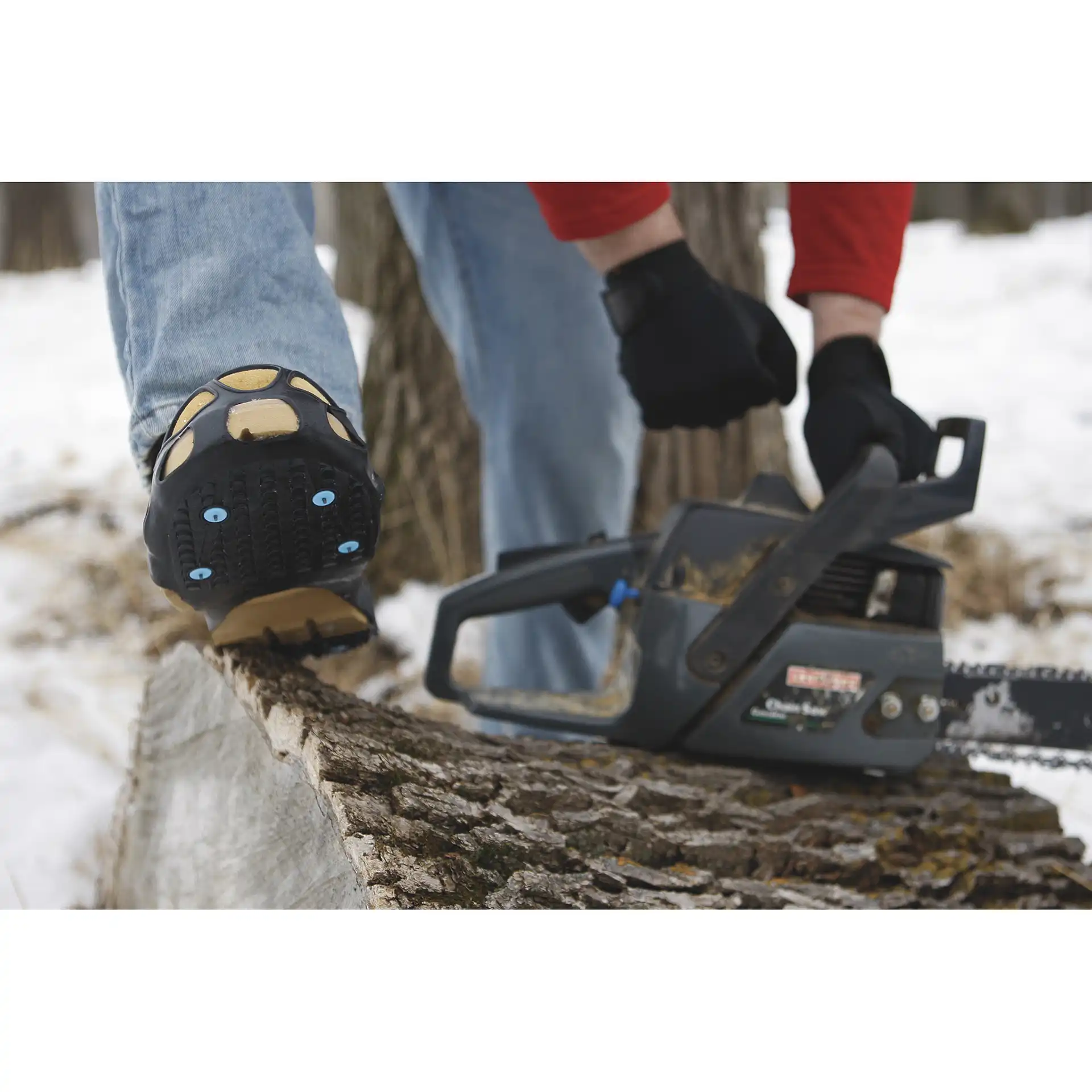 DueNorth traction aids on a log while cutting firewood