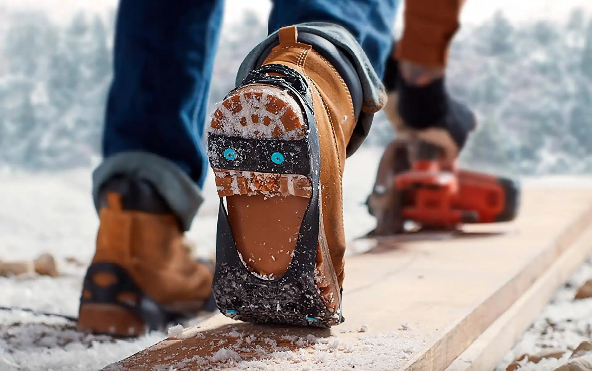 The heel strap of a DueNorth All Purpose traction aid on a work boot