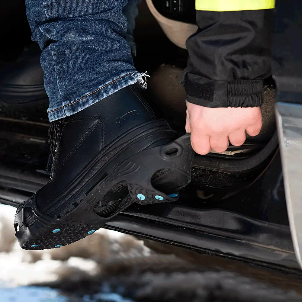 Stepping out of a truck in DueNorth All Purpose Industrial traction aids