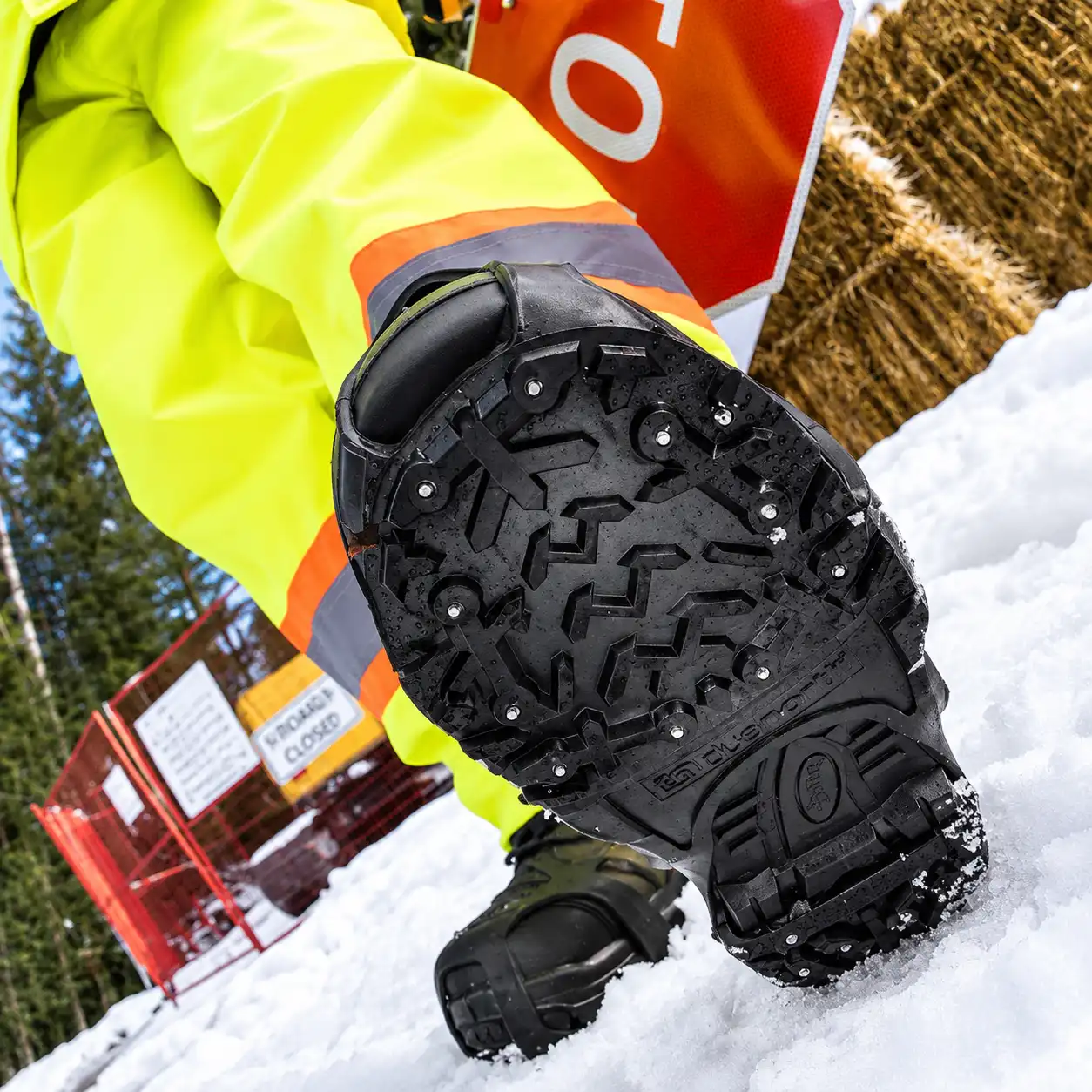 Climbing a snowy bank in DueNorth Heavy Duty traction aids