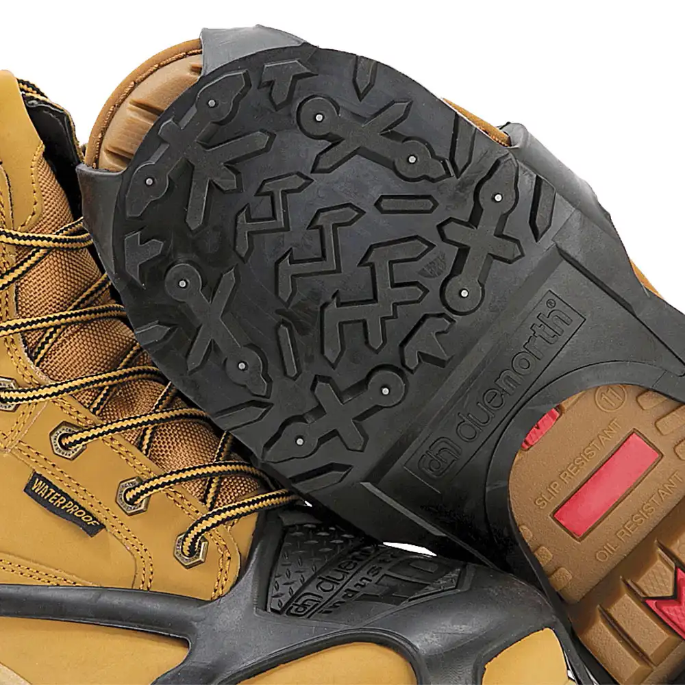 Molded-in spikes and tread on the sole of a DueNorth Heavy Duty traction aid