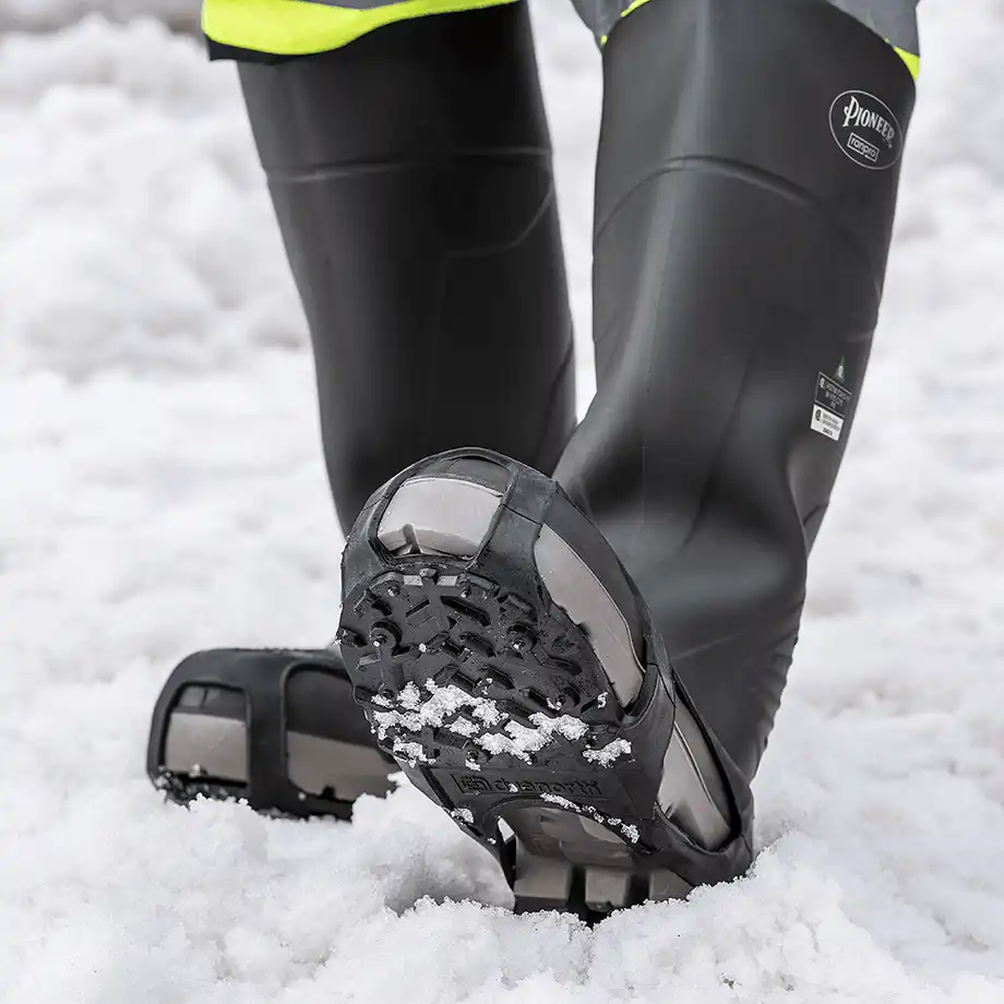 DueNorth Heavy Duty traction aids over rubber boots in the snow